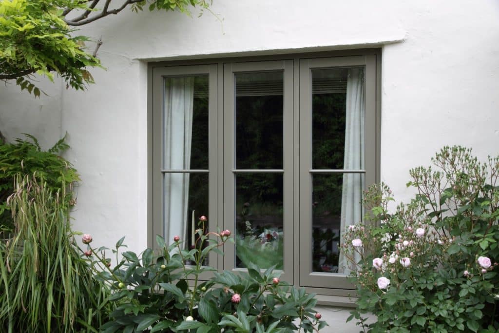 Timber flush casement window in Oxford Clay with single, fine astragal bar