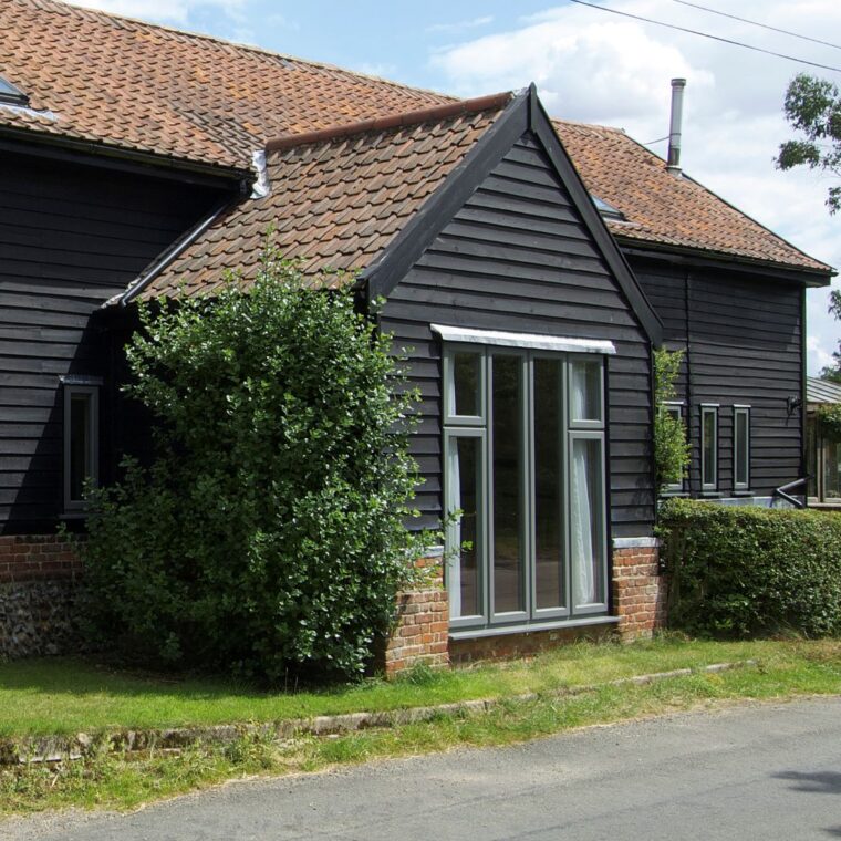 Contemporary Lipped Casement windows (StormProof Windows) in London Grey with stainless steel ironmongery