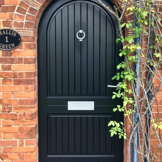 Black Arched Timber Entrance Door in Essex