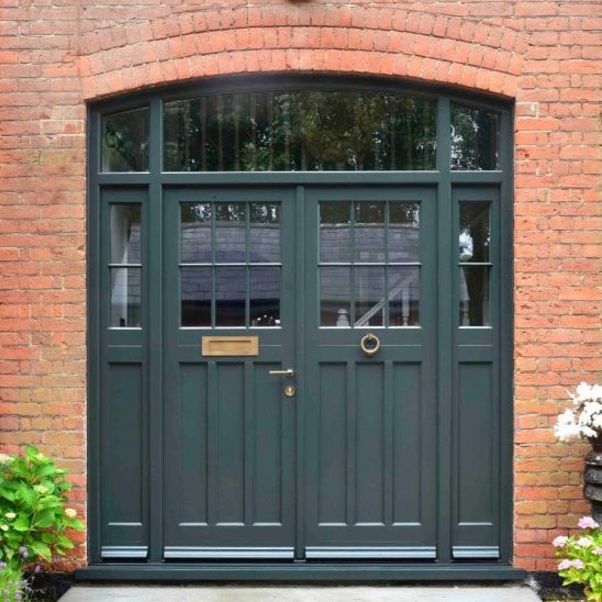 Double 'Polstead' Timber Front Doors in Studio Green, 18mm astragal bars and Samuel Heath antique brass unlacquered ring knocker, contour handle and letter plate