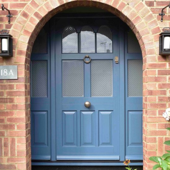 'Wakehurst' Hardwood Timber Townhouse Entrance Door with 'Frenchay' Side Panels, Toplight and Etched Star Glass. Farrow & Ball Stiffkey Blue Colour Match & Tombstone Glazing Features.