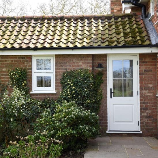 White timber casement window and glazed rear door in Suffolk