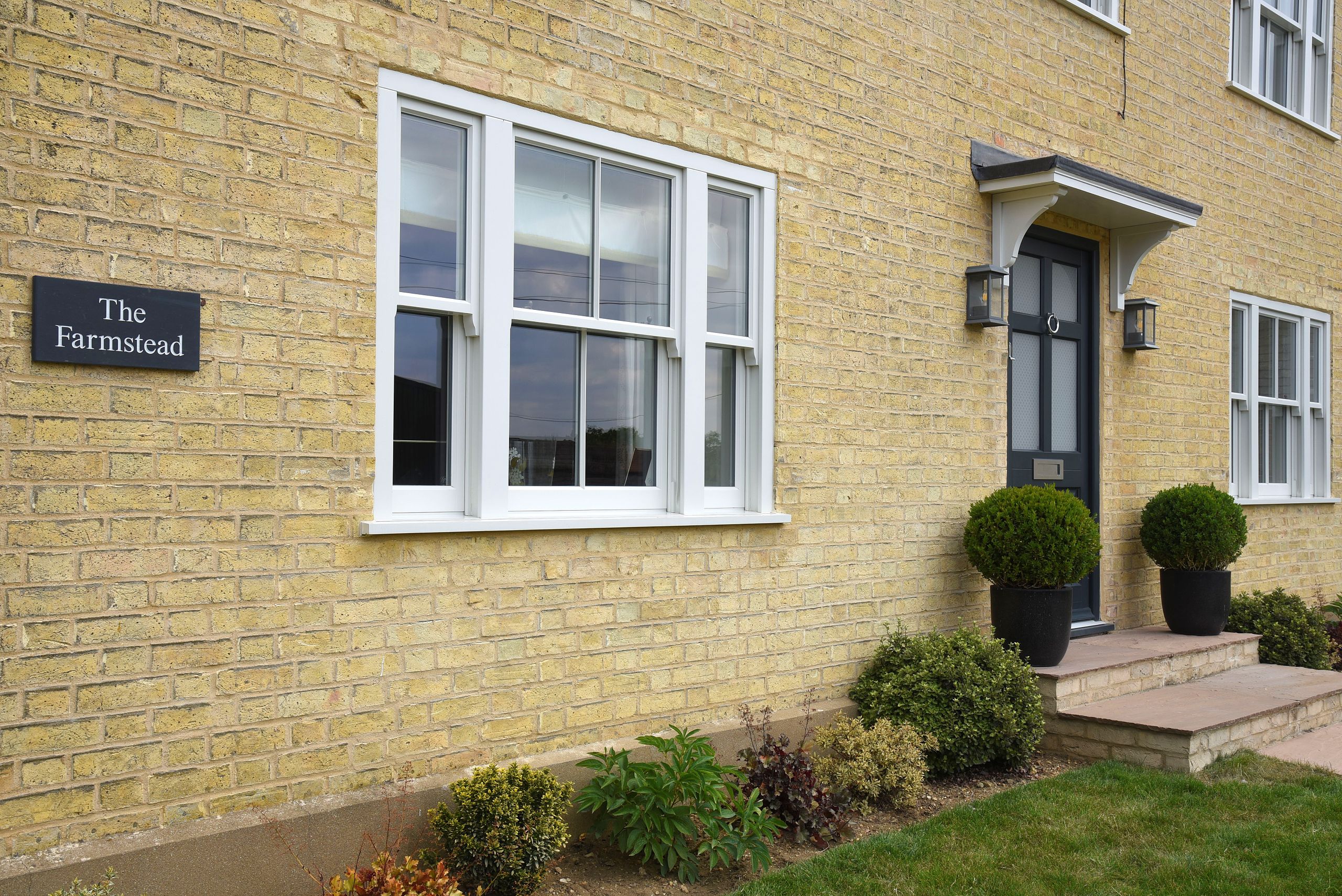 Smoke Cream Venetian hidden spring timber sash windows and Frenchay townhouse style door in Anthracite