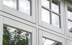 Evolution flush PVCu window with timber look joints