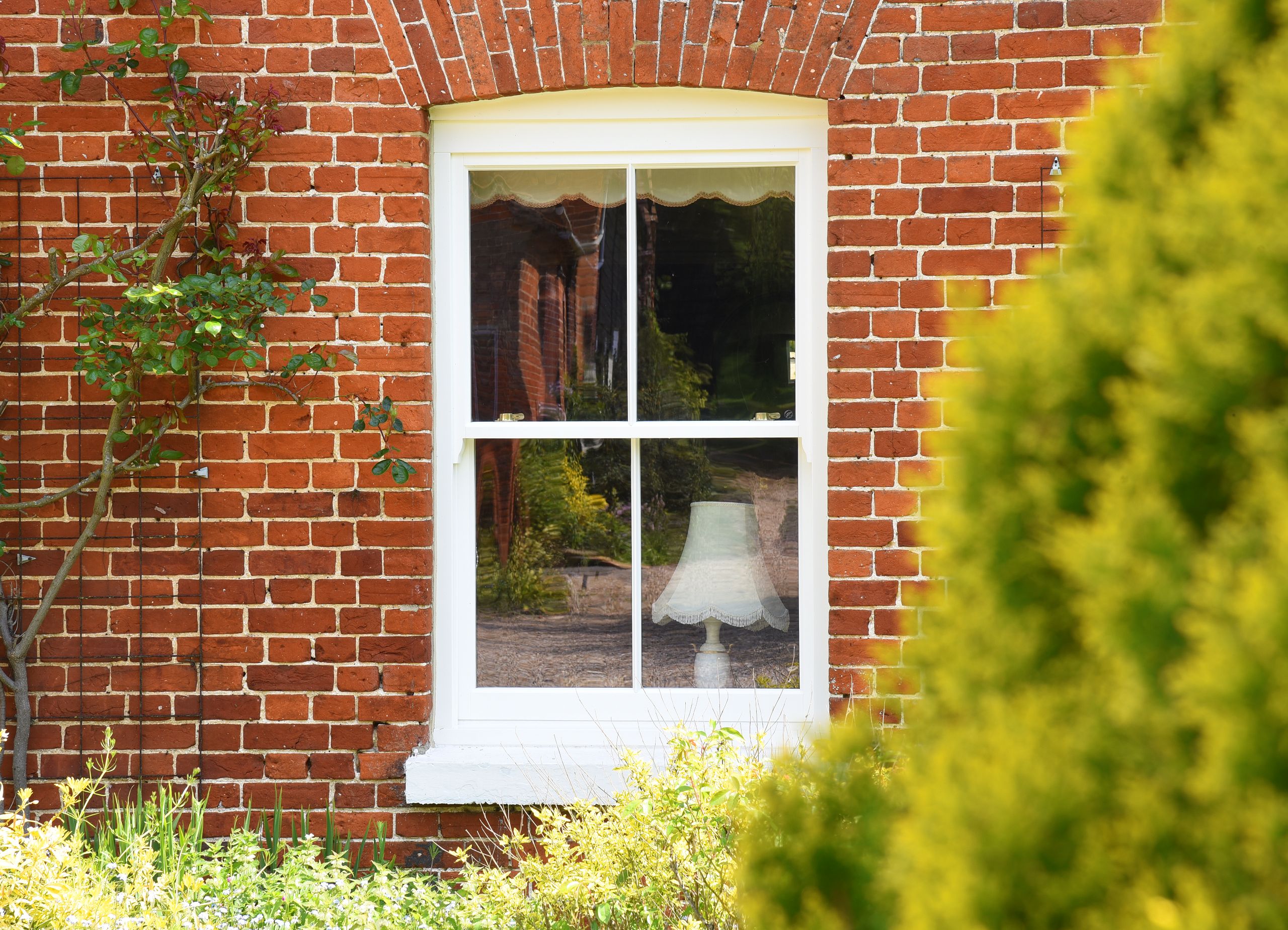 Slim wooden sash window with 18mm astragal bar in off white