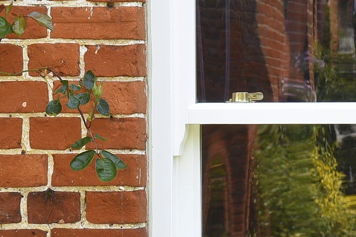 Slim wooden sash window with 18mm astragal bar in off white