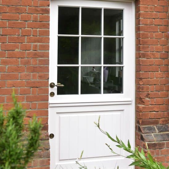 Stratfield timber stable door with plank effect door panel and 18mm glazing bars