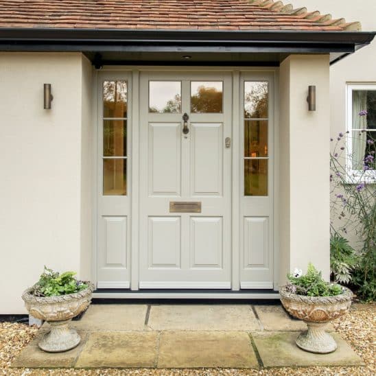 Timber Chalfont townhouse door with side panels, 18mm glazing bars and polished brass furniture