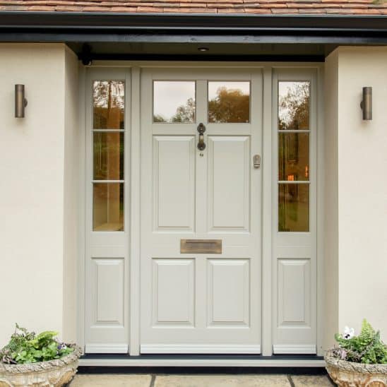 Timber Chalfont townhouse door with side panels, 18mm glazing bars, polished brass furniture