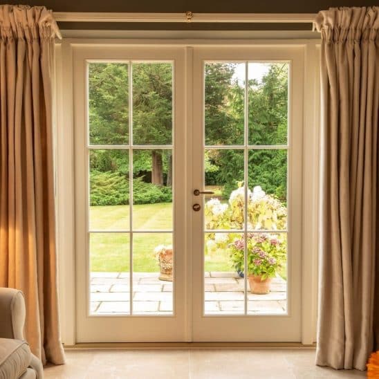Timber French doors and side panels with ovolo moulding & 18mm glazing bars
