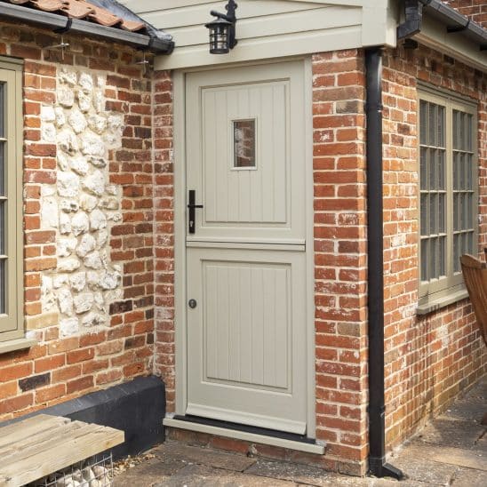Timber Staverton stable door with plank effect door panels and Avon black handle