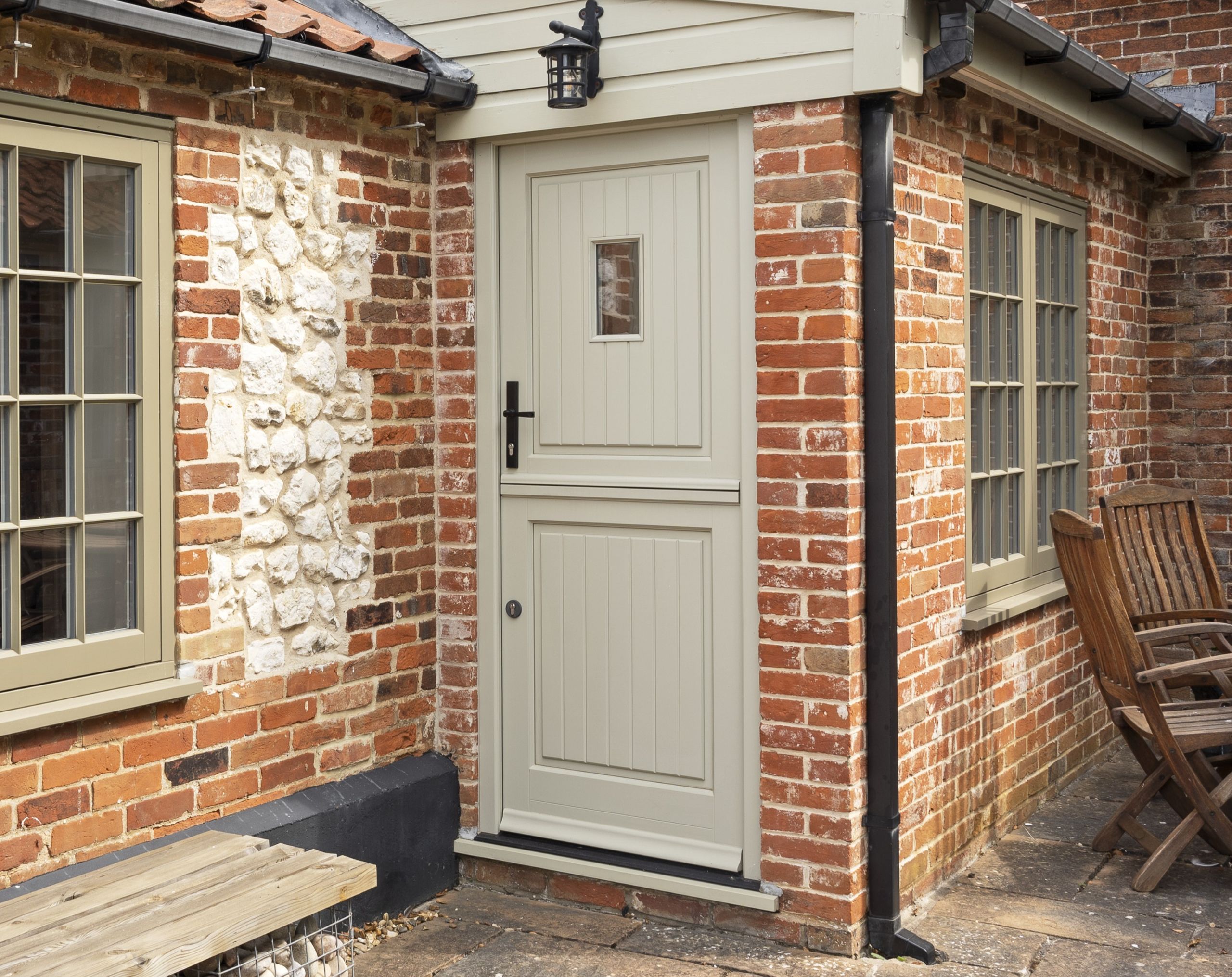 Timber Staverton stable door with plank effect door panels and Avon black handle