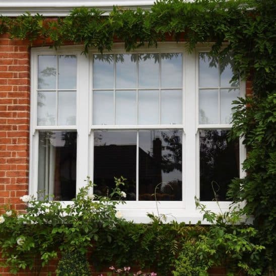 White timber venetian sash windows with 18mm astragal bars