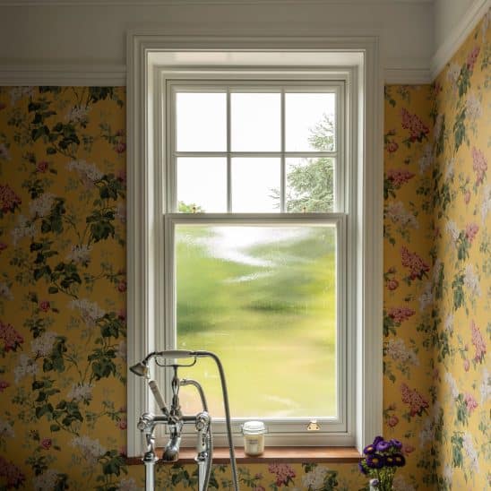Slim timber sash window with ovolo moulding and 18mm astragal squares to top sash