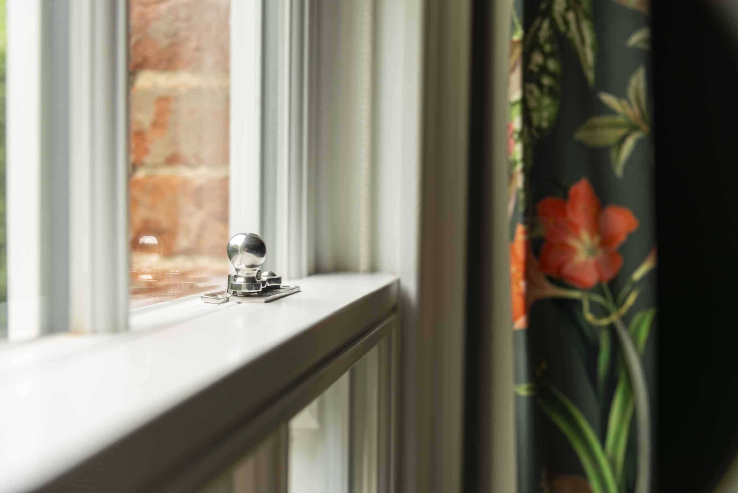 Slim timber sash windows with 18mm bars & polished stainless steel hook fastener