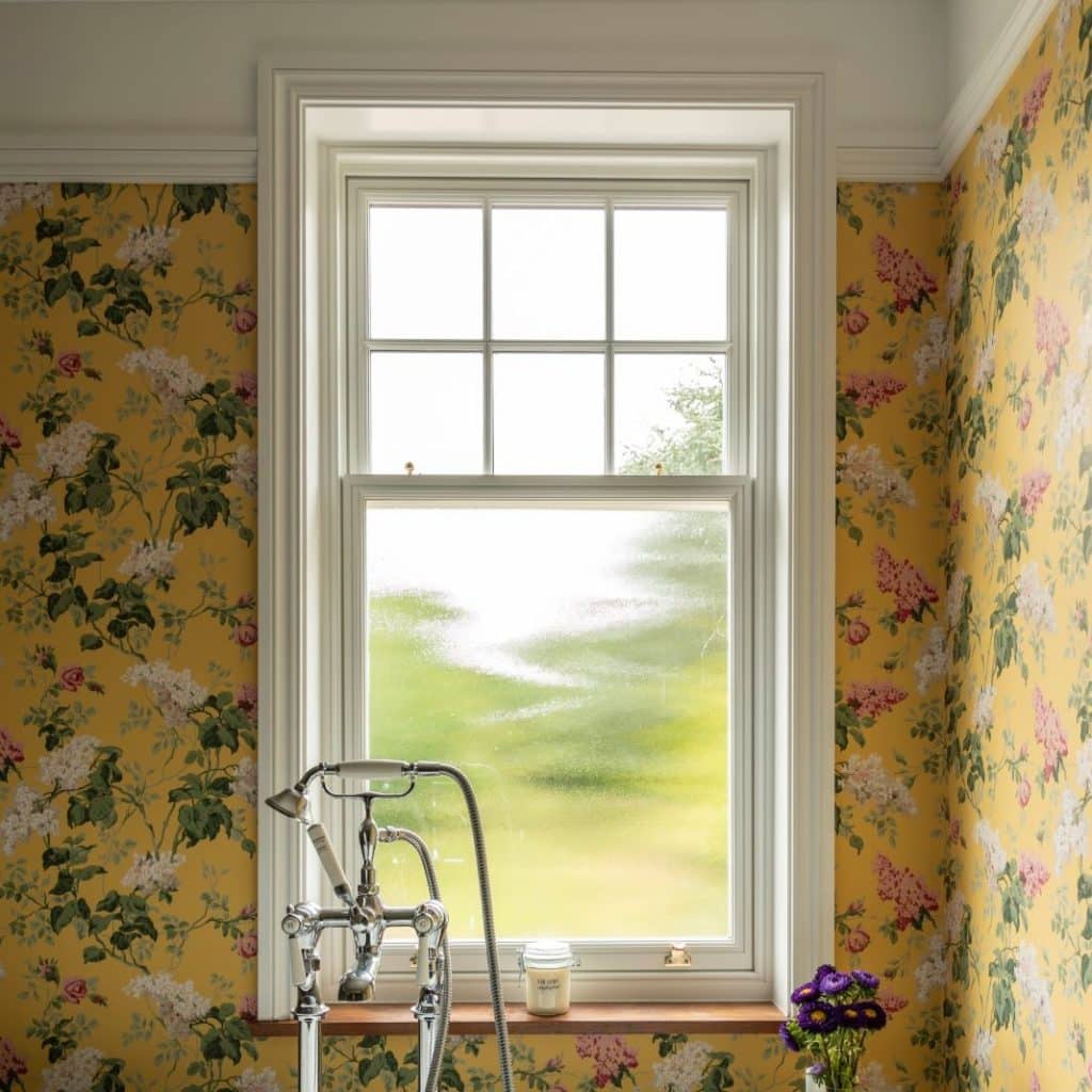 Slim wooden sash window with ovolo moulding and 18mm astragal squares to top sash