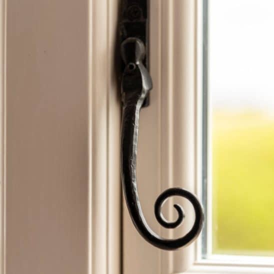 Evolution PVCu Timber Alternative casement windows in white with black monkeytail handle