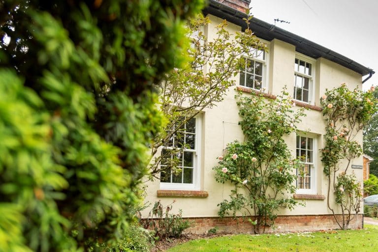 Engineered timber sash windows with 18mm glazing bars in white