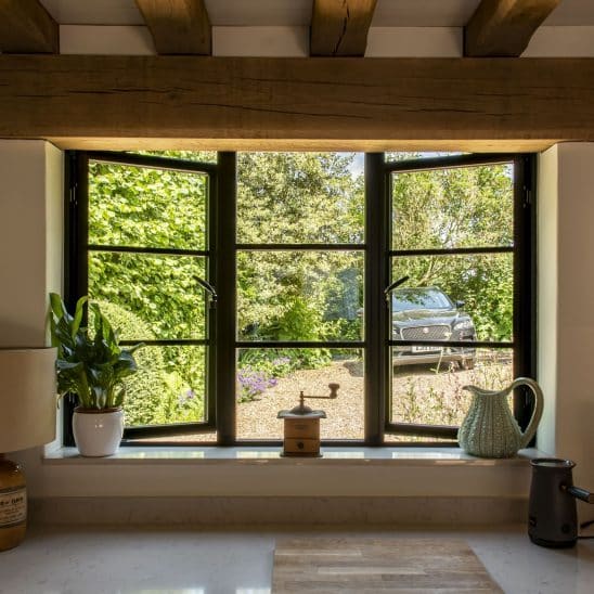 Aluco aluminium steel look windows with super slim glazing bars in black