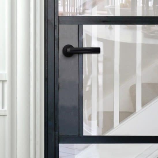 Black Aluco internal door with black Leon handle and steel look glazing bars