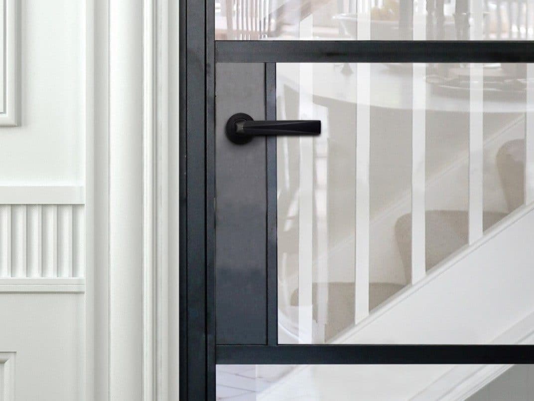 Black Aluco internal door with black Leon handle and steel look glazing bars