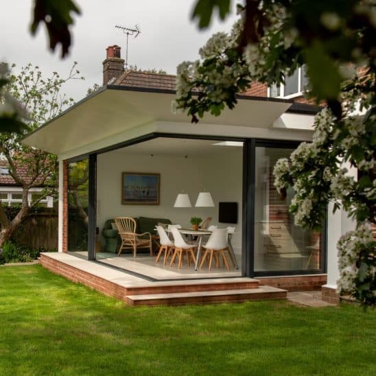 Open corner Sunflex SVG20 ultra slim aluminium sliding doors with 20mm interlock.