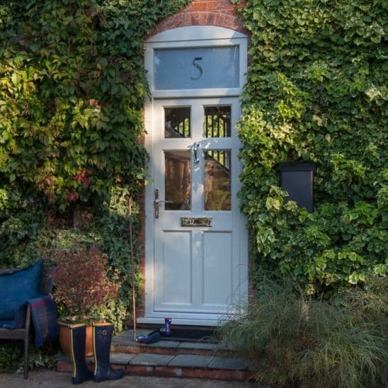 Evolution PVCu entrance door with sandblasted number in fanlight