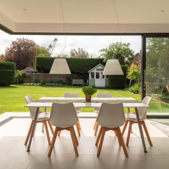 Open corner Sunflex SVG20 ultra slim aluminium sliding doors with 20mm interlock.