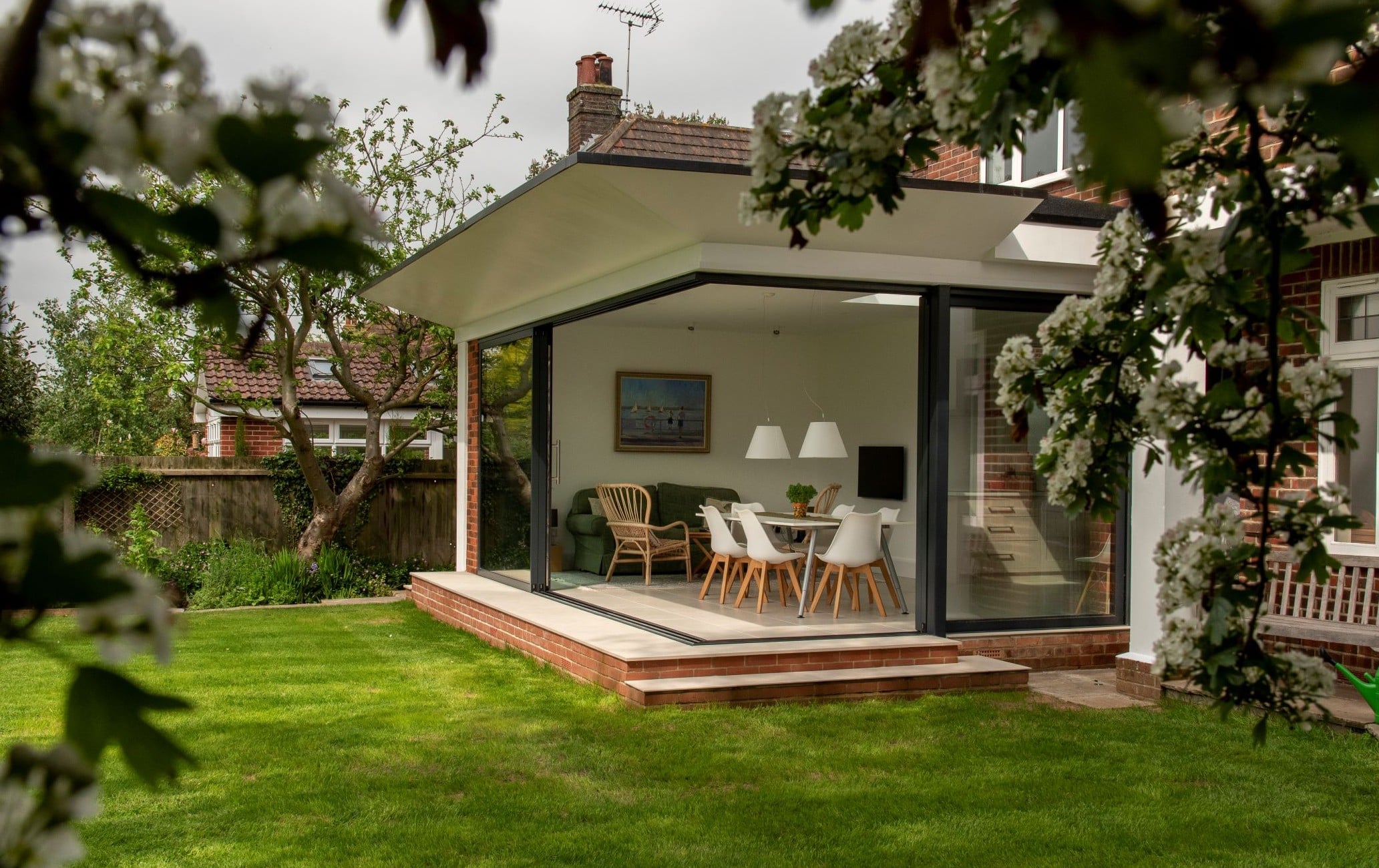Sunflex SVG20 ultra slim aluminium sliding doors with an open corner and 20mm interlock.