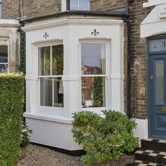 Timber sash window with 18mm astragal bars in white