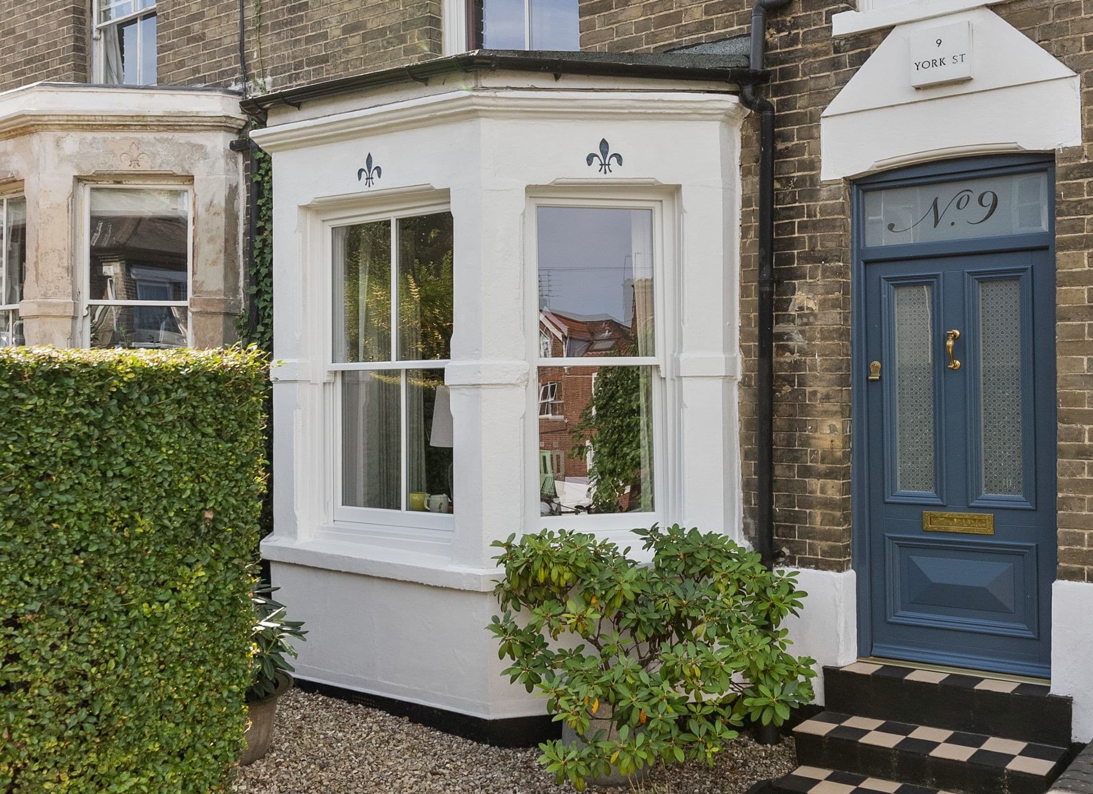 Timber sash window with 18mm astragal bars in white
