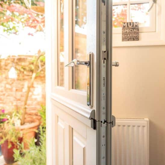 Engineered timber Kingston townhouse stable door in French Grey with 316 Coastal handle.
