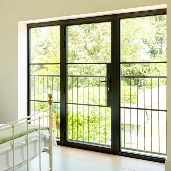 Aluco aluminium steel look French windows with side panels and super slim 20mm glazing bars in matt Black