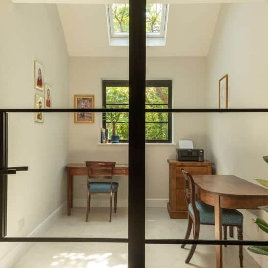 Aluco aluminium steel look internal glazed door with side panel, super slim 20mm glazing bars and Leon handle in matt Black