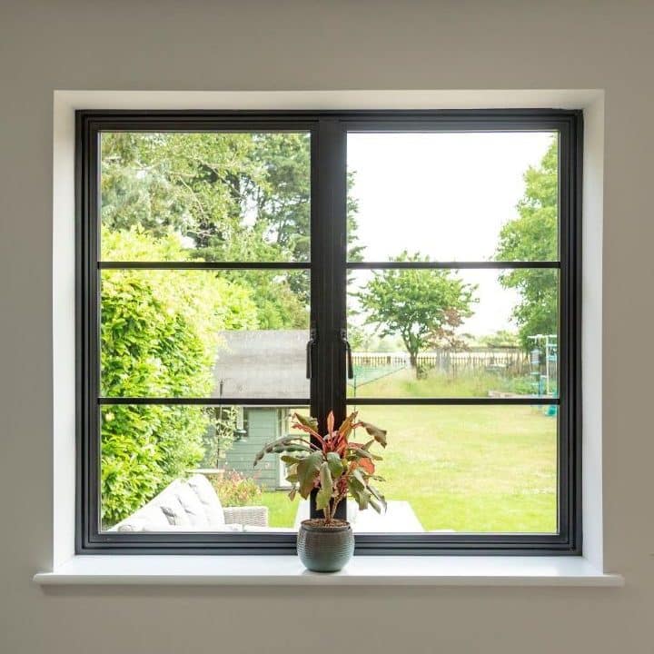 Aluco aluminium steel look window with super slim glazing bars in matt Black with Newbury handle