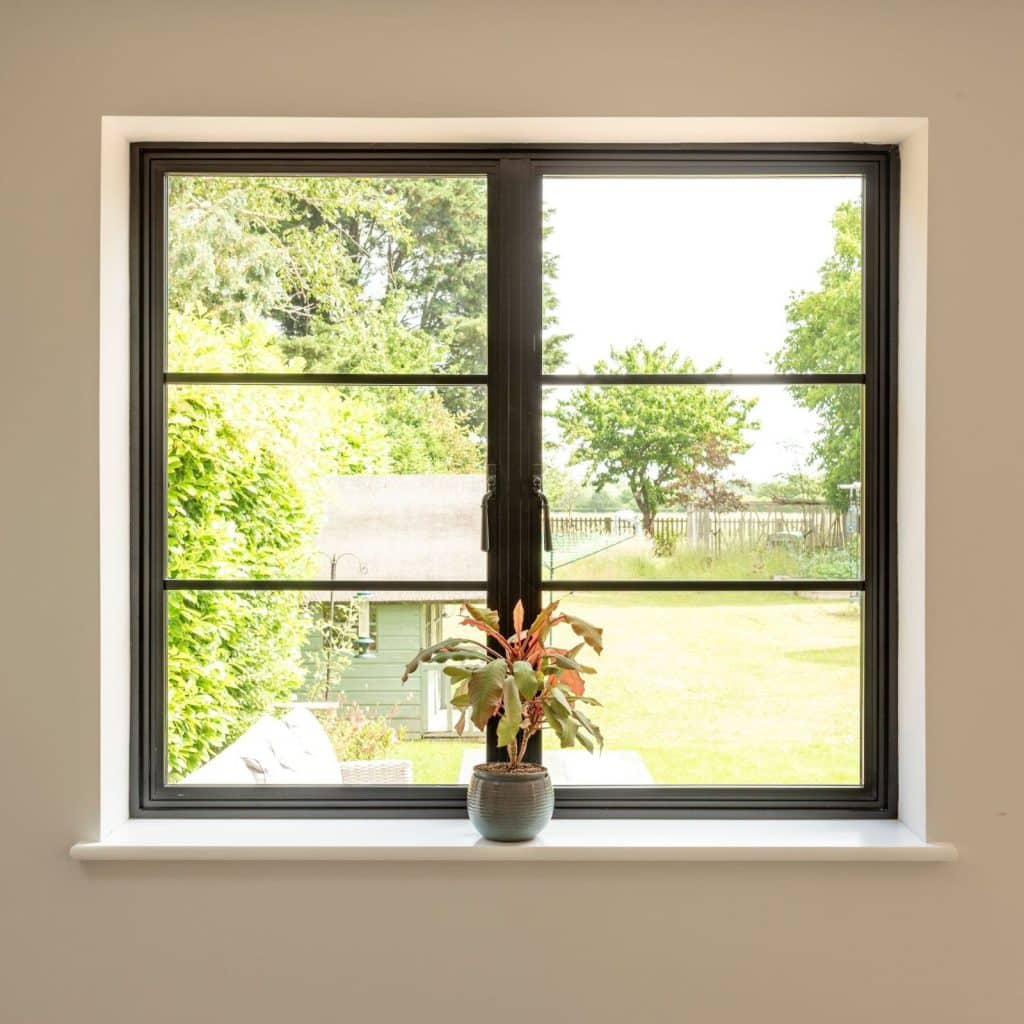 Aluco aluminium steel look window with super slim glazing bars in matt Black with Newbury handle