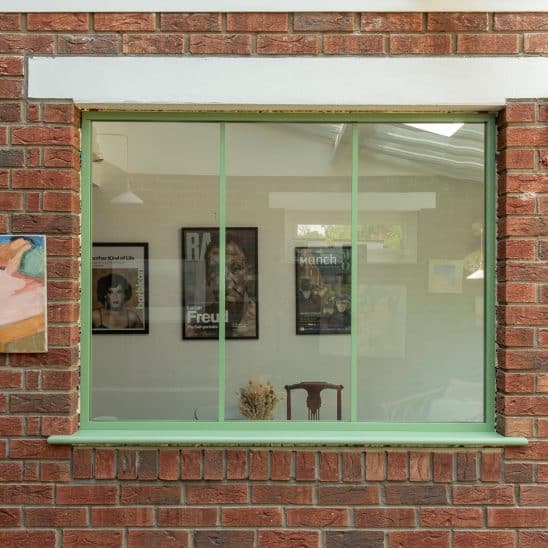 Green Aluco steel look internal fixed window screen.