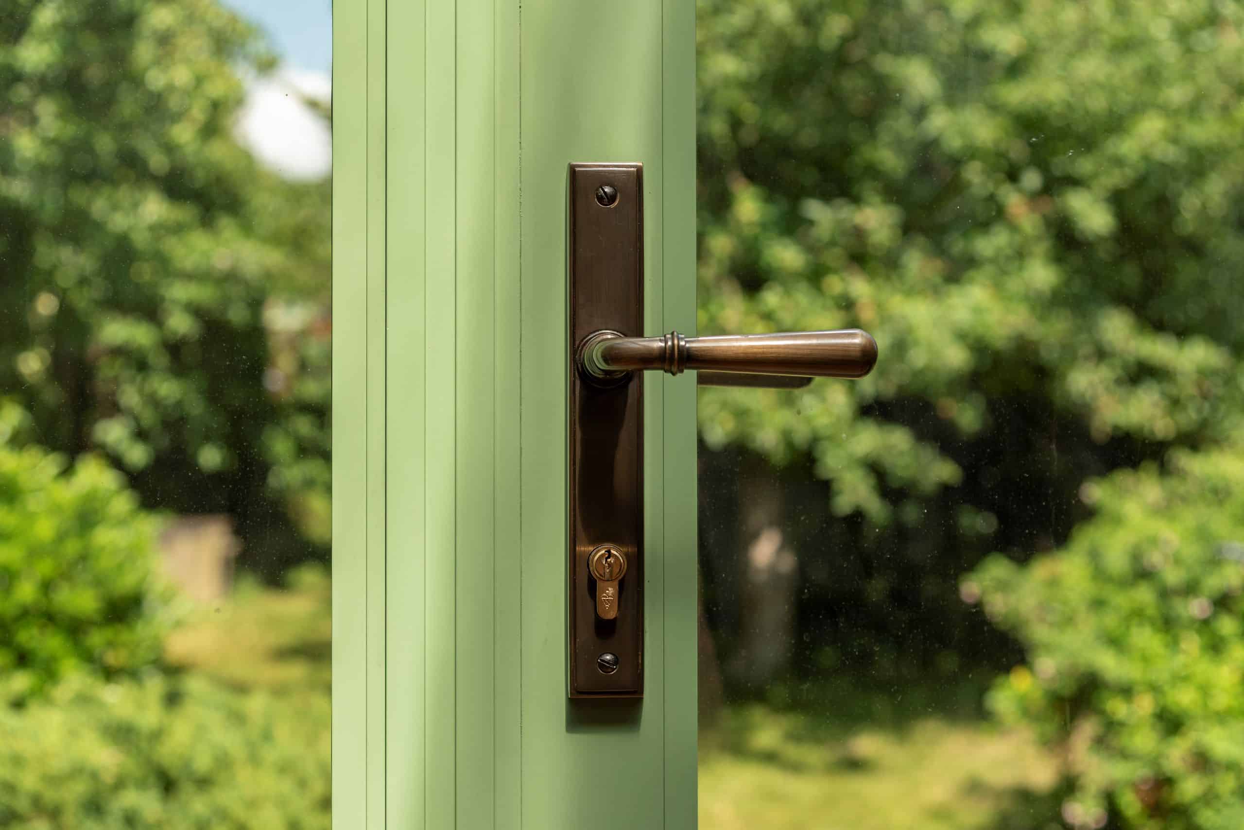 Green Aluco steel look French doors with antique brass Newbury handle