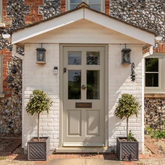 Engineered timber 'Frenchay' townhouse door with Samuel Heath antique brass unlacquered escutcheon, door knob and letterbox, in French Grey.