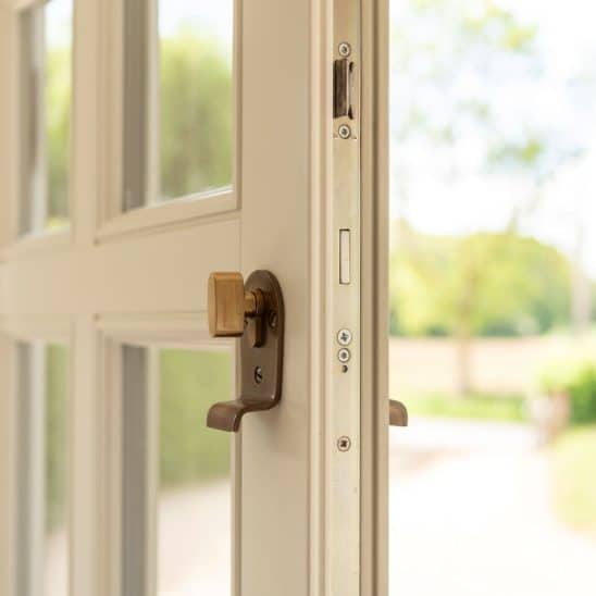 Engineered timber front 'Frenchay' townhouse door with Samuel Heath antique brass unlacquered escutcheon with thumbturn on the inside. Colour - Off White on the inside and French Grey on the outside.