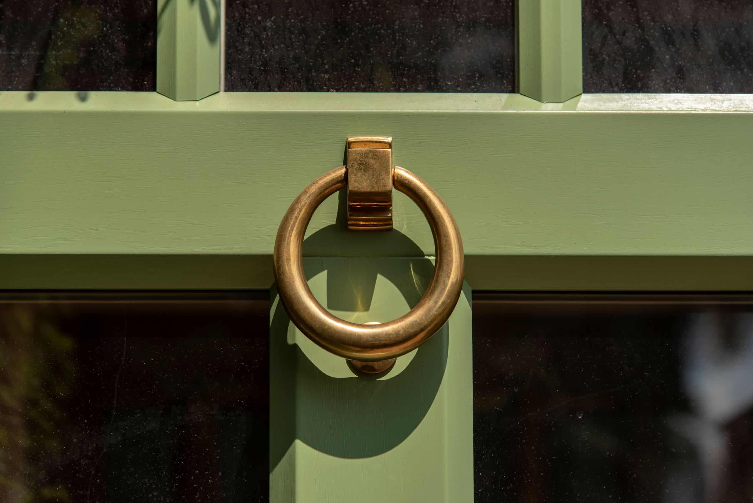 Evolution Ballingdon PVCu entrance door with brass ring door knocker.