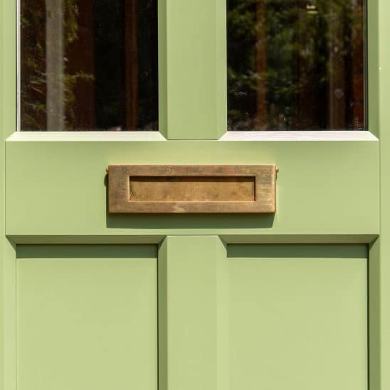 Evolution Ballingdon PVCu entrance door with brass flush letterbox.