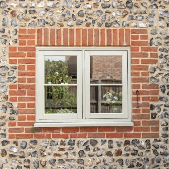 Evolution PVCu flush casement window with a single, timber look horizontal Georgian bar in Olive Grey