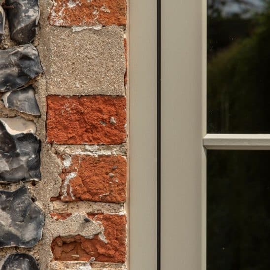 Evolution PVCu flush casement window with a single, timber look horizontal Georgian bar in Olive Grey