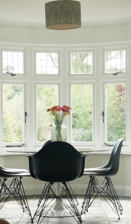 White engineered timber casement windows with leaded lights