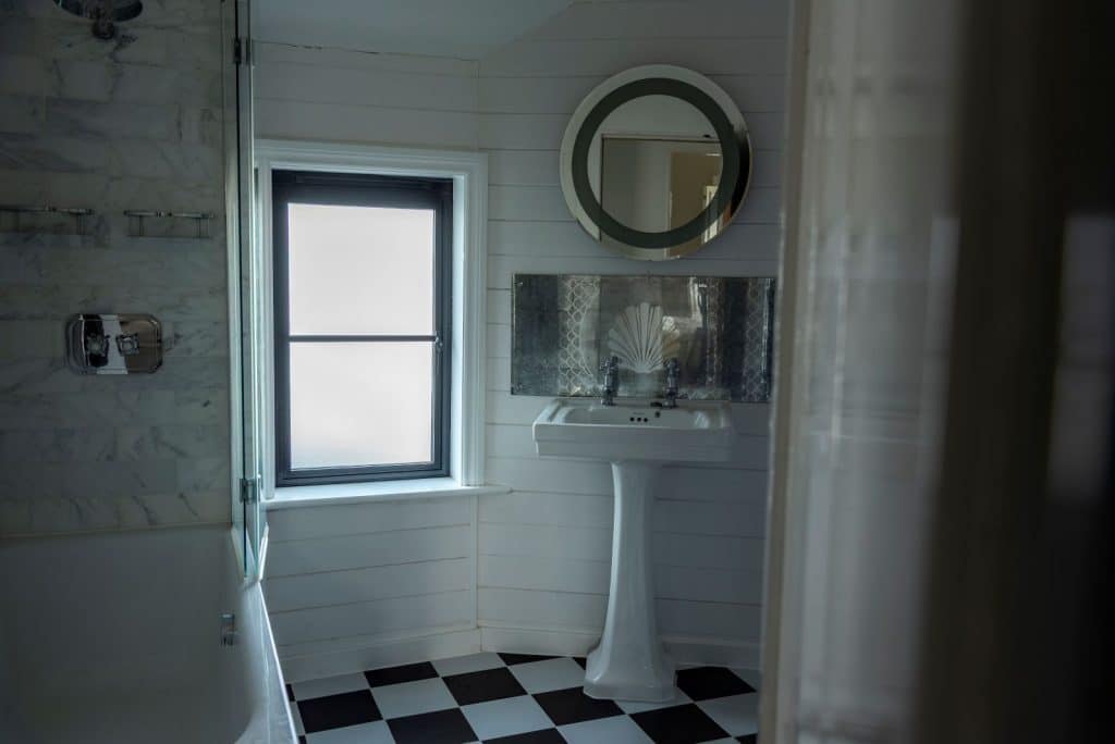 Black heritage, Art Deco aluminium bathroom window with obscured glass and super slim glazing bars