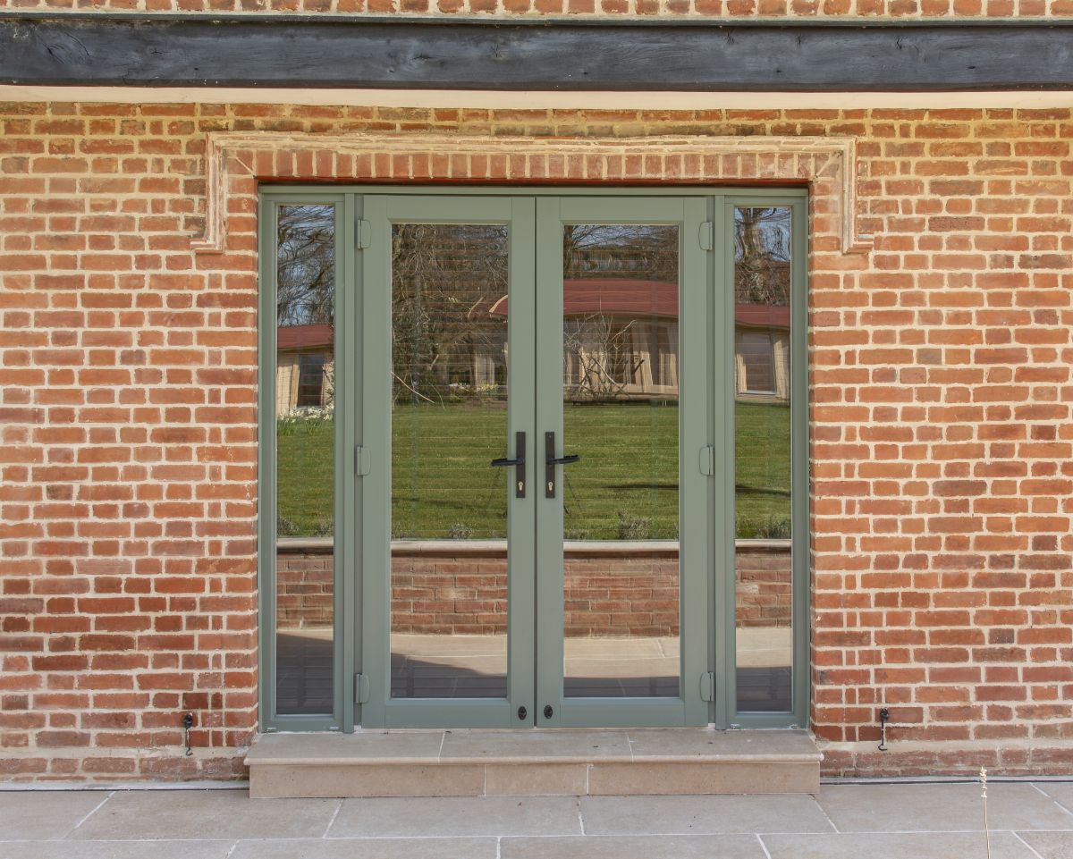 Evolution PVCu fully glazed French doors with side panels