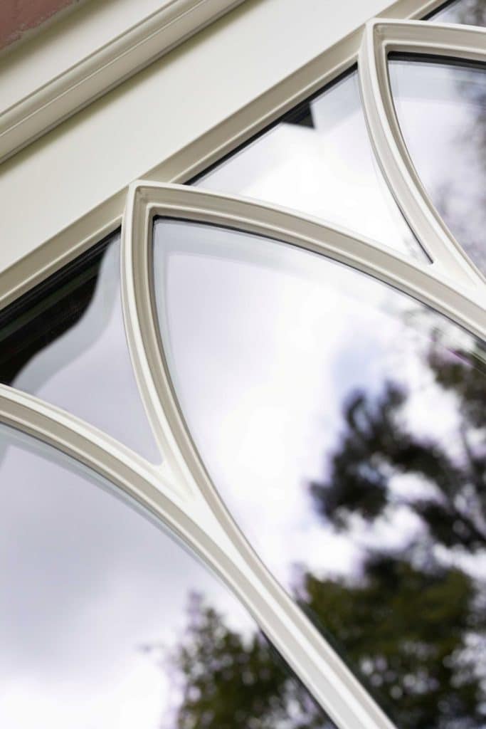 Gothic shaped astragal bars in off-white on timber townhouse front door