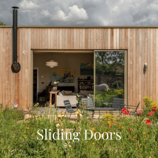 2.8 metre high Sunflex SVG20 aluminium sliding doors in Olive Grey with 20mm sightlines and flush stacking panels.