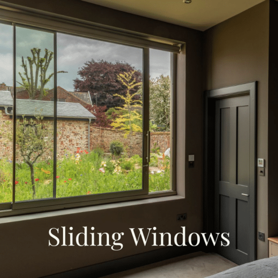 Sunflex aluminium SVG20 sliding windows with ultra slim 20mm sightlines and stainless steel bar handle, in Olive Grey